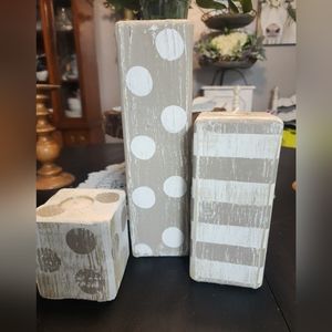 Set of three handmade wood candleholders.